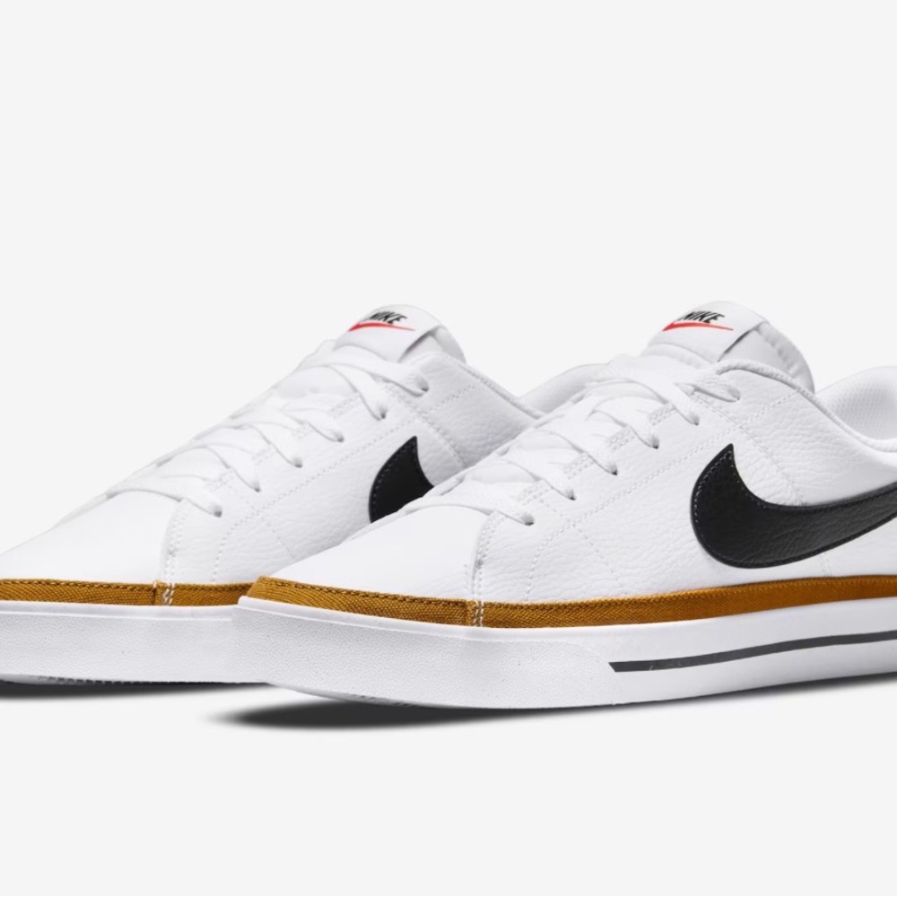 Nike White Shoes with Black Logo and Gold Accent